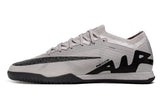 chuteira-futsal-nike-air-zoom-mercurial-vapor-15-ellite-ic-cinza-e-preto-rising-gem-pack-1